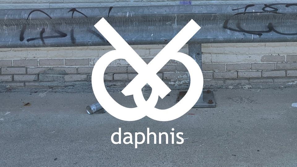 a logo of two interlocking "d"s and a background of concrete + a spray paint can