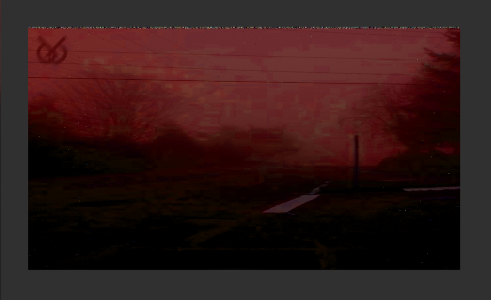 red sky and a compressed looking image stretches out into shadows. 