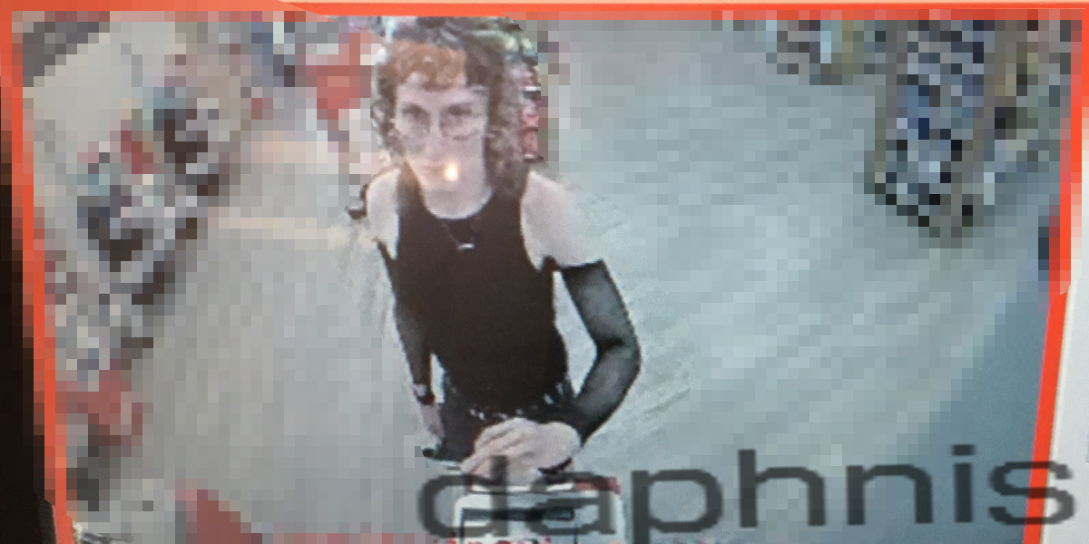 daphnis in a cvs checkout surveillance camera with a pixelated background and distorted title "daphnis"
